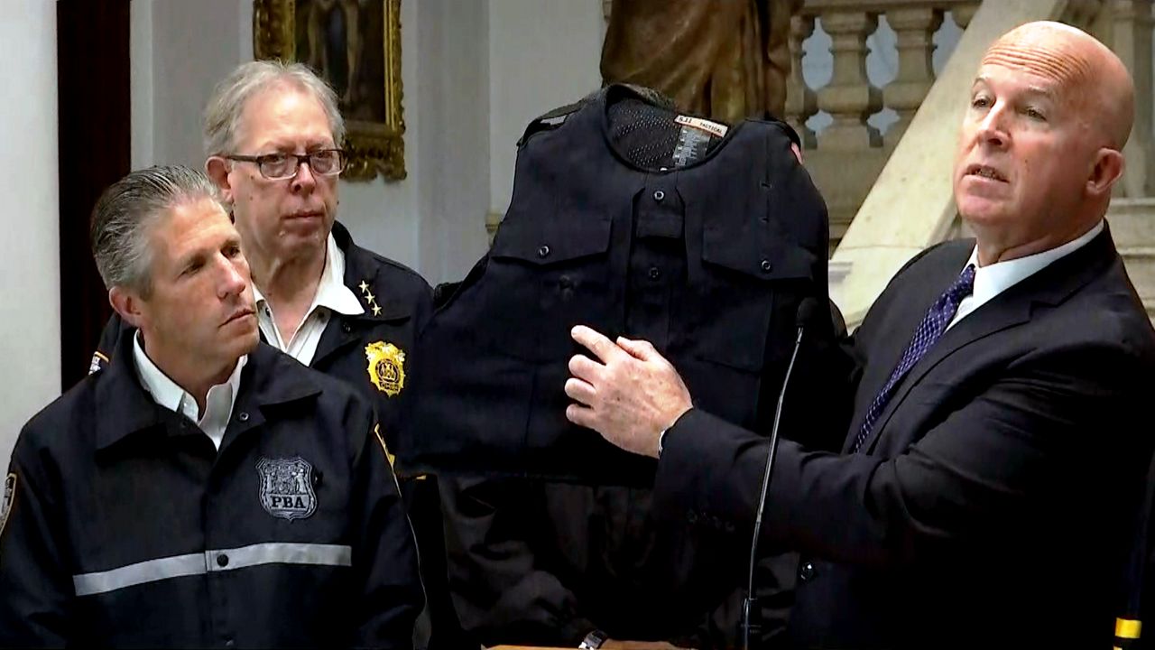 a black police vest, police