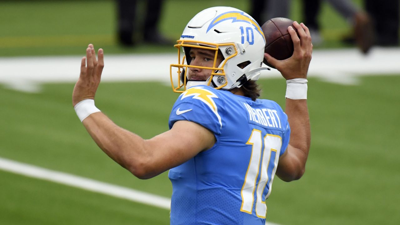 Los Angeles Chargers quarterback Justin Herbert (10) warms up before an NFL football game against the Jacksonville Jaguars Sunday, Oct. 25, 2020, in Inglewood, Calif. (AP Photo/Kyusung Gong)