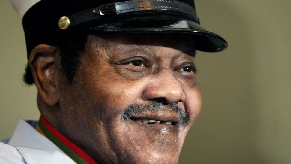 Fats Domino was named "Honorary Grand Marshall" of the Krewe of Orpheus, the club that traditionally parades the night before Mardi Gras, Friday, Dec. 20, 2013, in New Orleans. (AP/Doug Parker)
