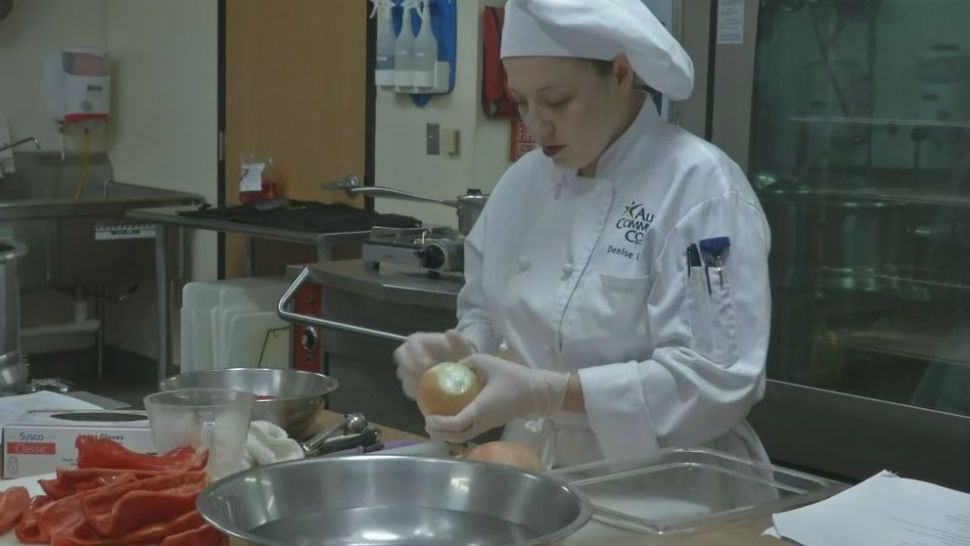 An Austin Community College culinary student peels onions. (Spectrum News/File)