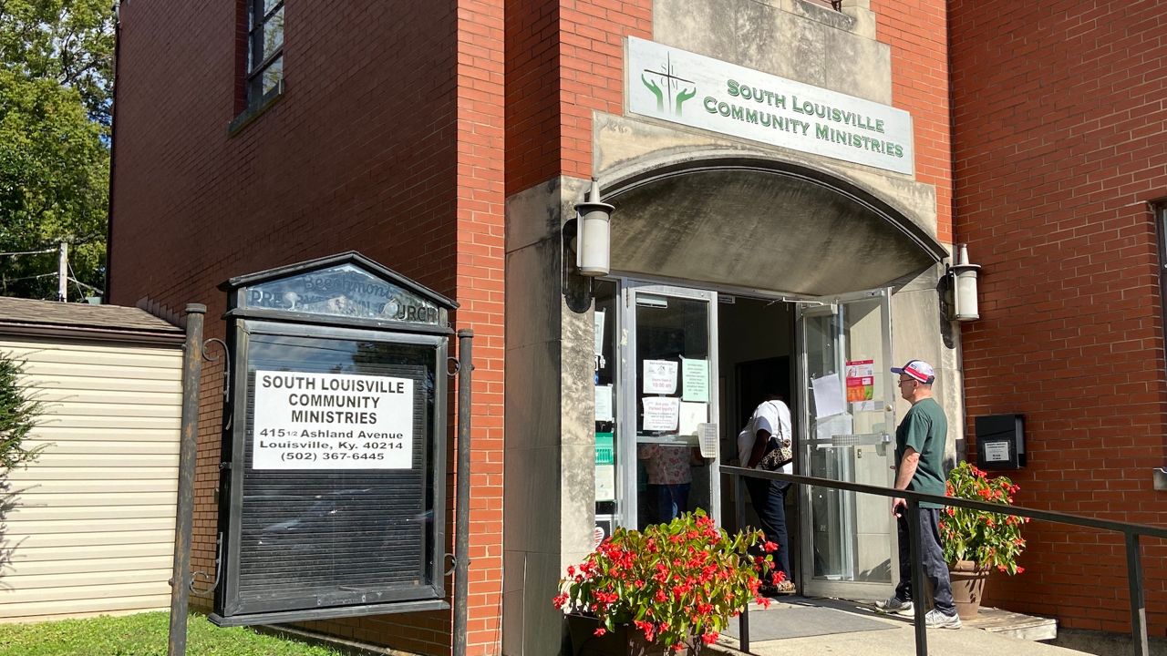 Clients spill out of the door at a Louisville rental assistance clinic. (Spectrum News 1 KY/Adam K. Raymond)