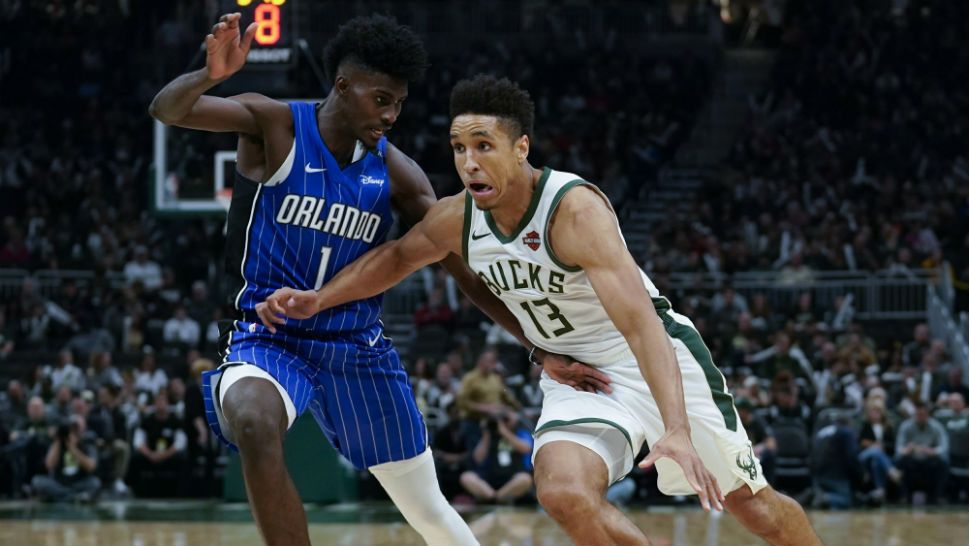 Milwaukee Bucks' Malcolm Brogdon drives past Orlando Magic's Jonathan Isaac during the second half of an NBA basketball game Saturday, Oct. 27, 2018, in Milwaukee. (AP Photo/Morry Gash)