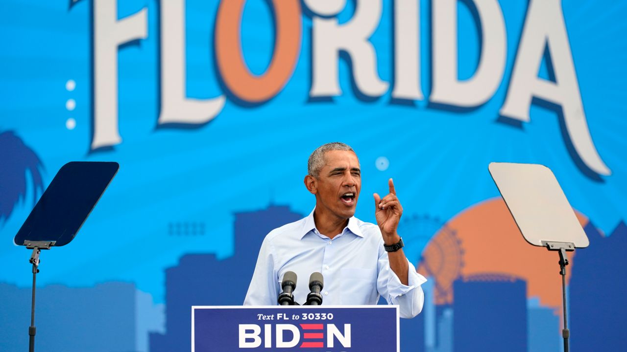 Former President Barack Obama speaks just outside Camping World Stadium in downtown Orlando in support of Democratic presidential candidate Joe Biden on Tuesday, October 27, 2020. (John Raoux/AP)