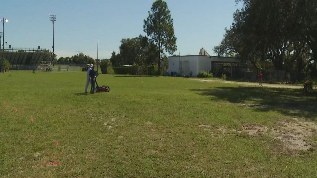Geologists spent the afternoon of October 23 on the King High School campus on North 56th Street in Tampa conducting a subterranean scan of a field to determine if graves are buried are on the site. (Spectrum Bay News 9)
