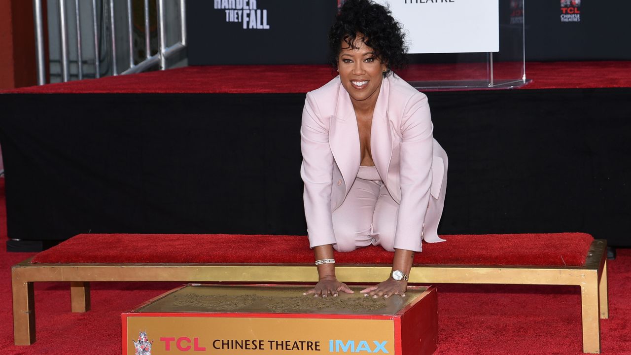 Regina King poses for photos while placing her hands in cement during a ceremony in her honor on on Thursday, Oct. 28, 2021 in Los Angeles. (Photo by Richard Shotwell/Invision/AP)