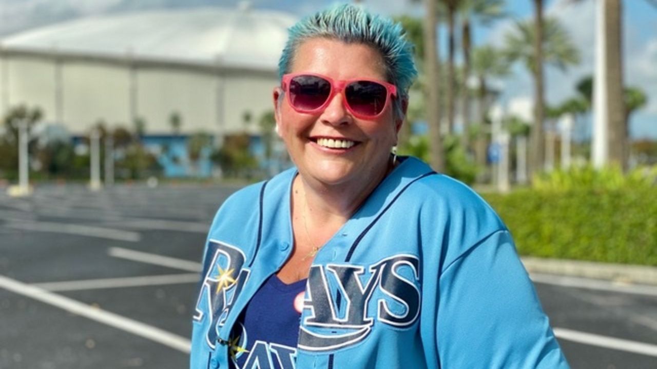 Colette Nichols-Watson of Chrystal River, in front the Trop before Game 6 of the World Series. She’s been a fan since the team’s 1998 inception. She says the Rays have heart. The longtime nurse says the Rays “heart" gives her heart hope -- and the good feelings necessary to combat the difficulty of the medical profession in a world pandemic.(Photo by Bobby Collins)