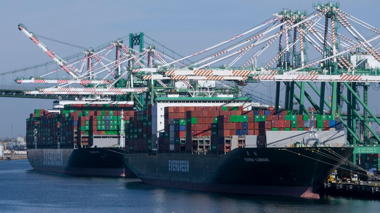 Cargo containers sit stacked on ships at the Port of Los Angeles, Oct. 20, 2021 in San Pedro, Calif.  (AP Photo/Ringo H.W. Chiu)