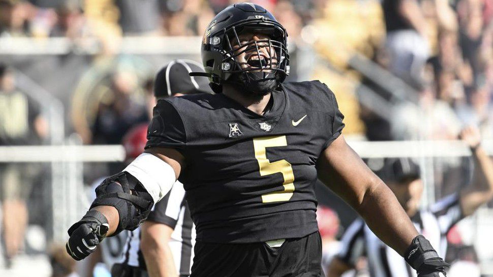 UCF defensive tackle Ricky Barber (5) celebrates after sacking Cincinnati quarterback Ben Bryant during the first half of an NCAA college football game, Saturday, Oct. 29, 2022, in Orlando, Fla. (AP Photo/Phelan M. Ebenhack)