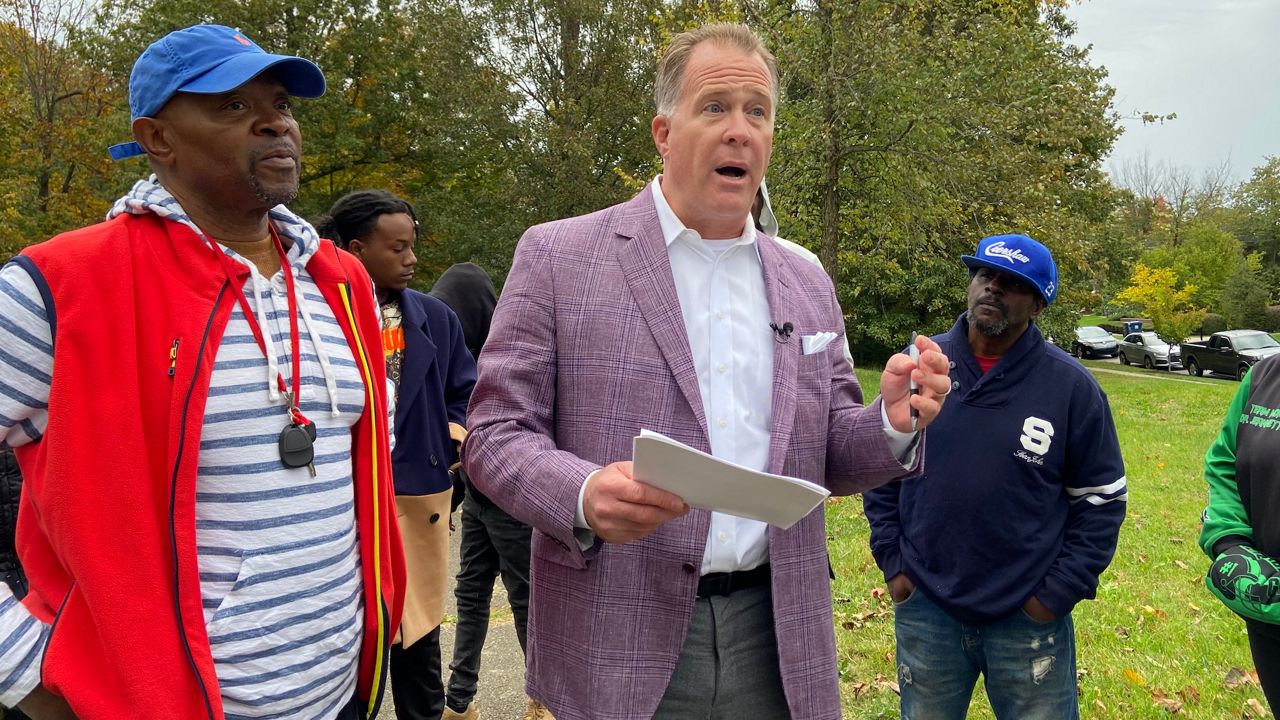 Neal Robertson (left) and Chris Thieneman (center) are being sued by the Glenmary HOA. (Spectrum News 1 KY/Adam K. Raymond)