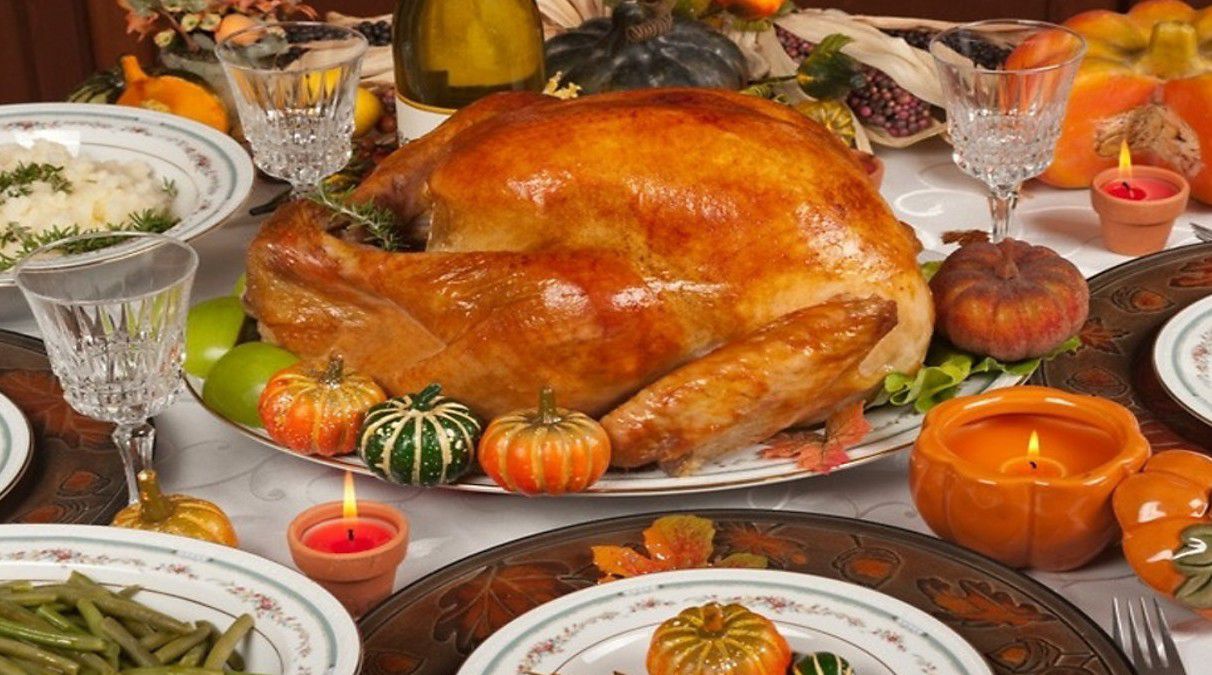 A Thanksgiving dinner set with a cooked turkey in the middle (Spectrum News 1/File)