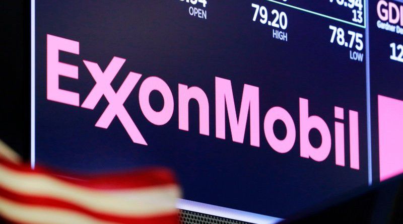 In this April 23, 2018, file photo, the logo for ExxonMobil appears above a trading post on the floor of the New York Stock Exchange. Exxon Mobil is slashing 1,900 jobs from its U.S. workforce as the pandemic continues to sap demand for fuel. (AP Photo/Richard Drew, File)