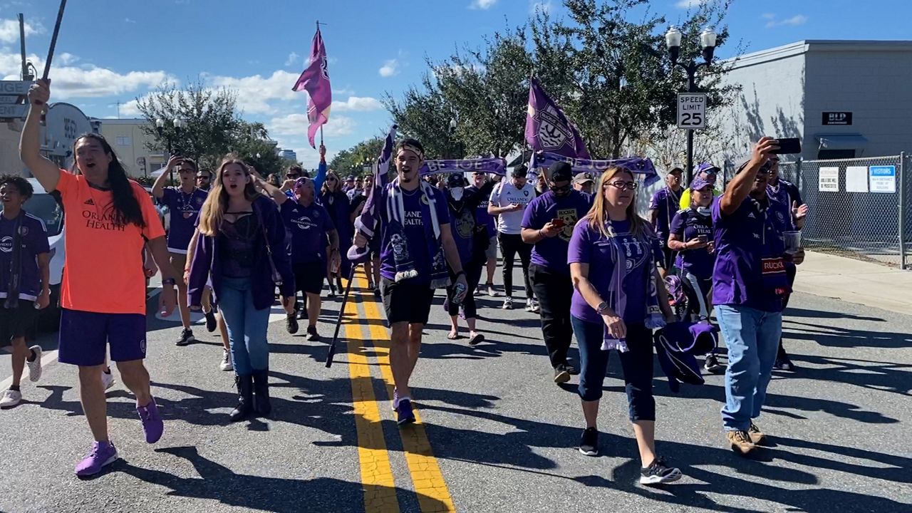 Orlando City fans march to the stadium ahead of the last regular season home game Sunday. (Spectrum News/Matt Fernandez)