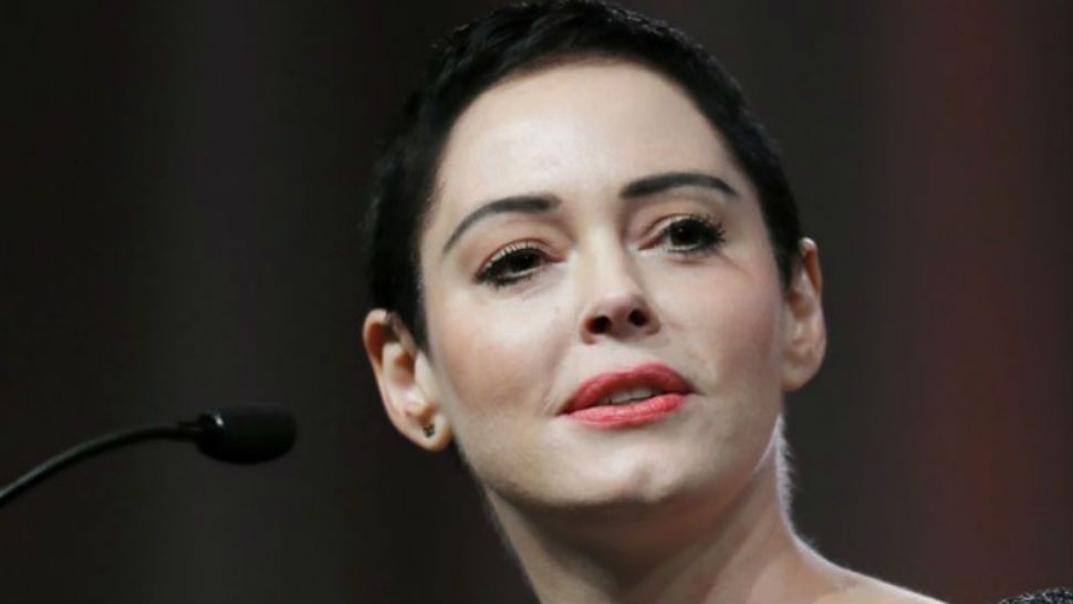 In this Oct. 27, 2017, file photo, actress Rose McGowan speaks at the inaugural Women’s Convention in Detroit. An arrest warrant has been obtained for McGowan for felony possession of a controlled substance. The felony charge stems from a police investigation of personal belongings left behind on a United flight arriving at Washington Dulles International Airport on Jan. 20. (AP Photo/Paul Sancya, File)