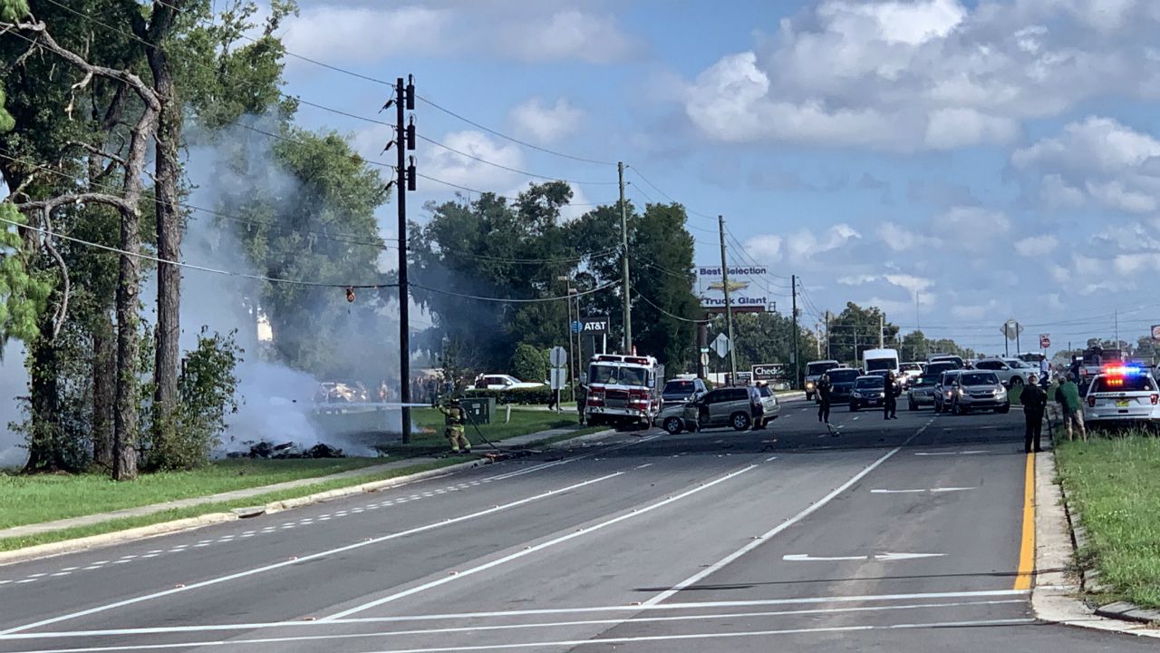 A picture sent to us from a witness in shows first-responders tending to a smoldering fire off Southwest College Road in Ocala. (Handout)