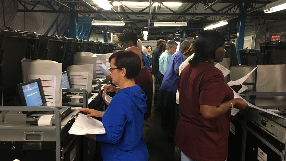 Hillsborough elections staff conduct tests on voting machines, Tuesday, October 16, 2018. (Dave Jordan/Spectrum Bay News 9)