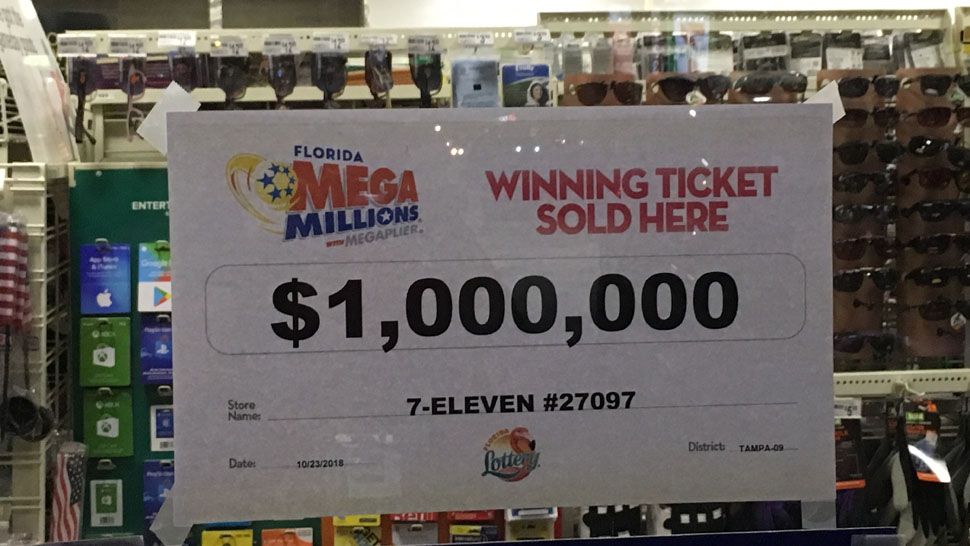 Sign hanging in the window at a 7-Eleven location in Tampa where a Mega Millions ticket worth $1 million was purchased prior to Tuesday's $1.6 billion jackpot drawing. (Laurie Davison/Spectrum Bay News 9)
