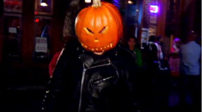 A person wears a pumpkin on his head celebrating Halloween on Sixth Street (Spectrum News file image)
