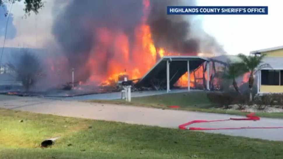 Flames erupt after a helicopter crashed on top of 2 mobile homes in Sebring on Tuesday afternoon. (Highlands County Sheriff's Office)