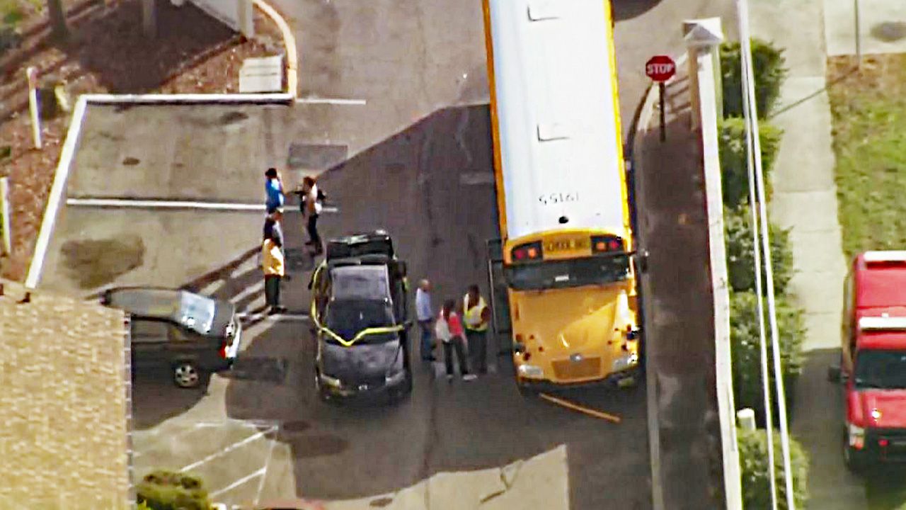 A car collided with a school bus carrying Lakemont Elementary School students collided at the 6900 block of Aloma Avenue in Winter Park on Friday morning. (Sky 13)