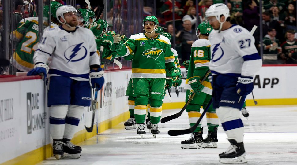 Minnesota Wild center Joel Eriksson Ek, center, celebrates at the bench after scoring during the second period of an NHL hockey game against the Tampa Bay Lightning, Friday, Nov. 1, 2024, in St. Paul, Minn. (AP Photo/Ellen Schmidt)