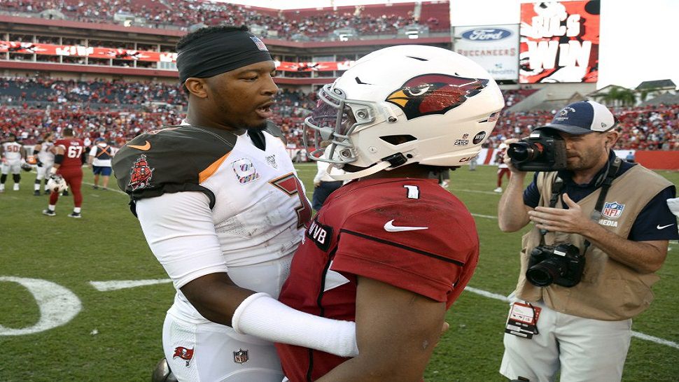 Tampa Bay Buccaneers quarterback Jameis Winston, left, talks to Arizona Cardinals rookie quarterback Kyler Murray after Tampa Bay's win over Arizona on Sunday.  The Buccaneers' win snapped a four-game losing streak.  (AP Photo/Jason Behnken)