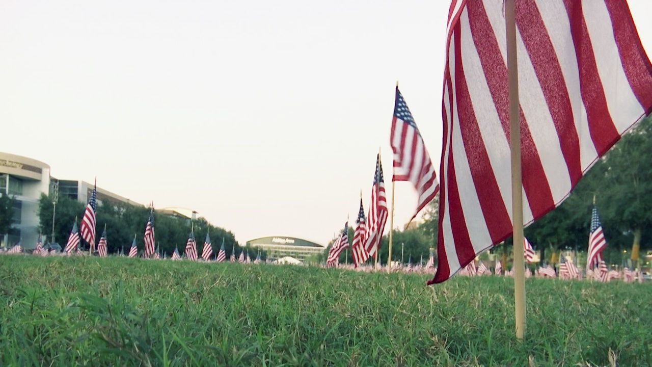 In total, 1,350 American flags filled the lawn with each flag representing a veteran currently enrolled at UCF. (Matt Fernandez/Spectrum News 13)