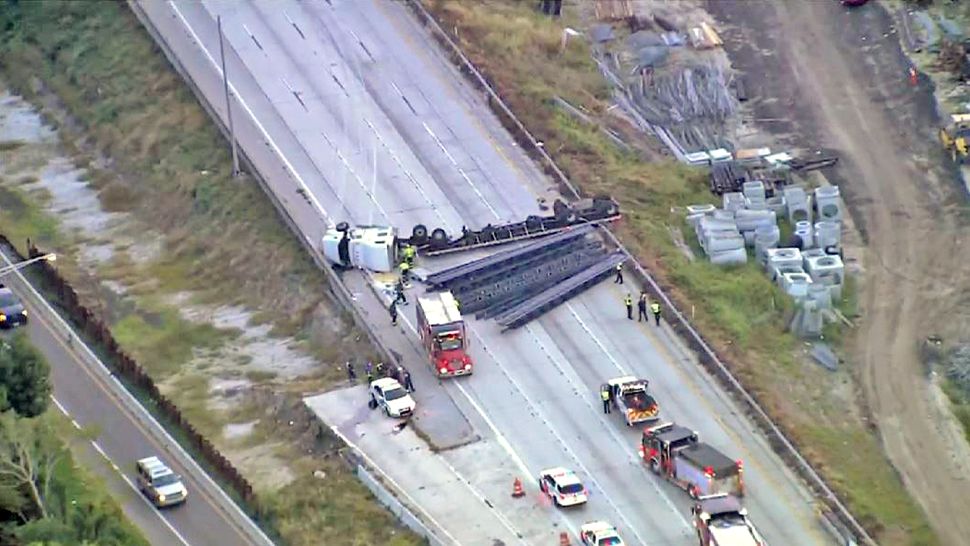 Witnesses told police investigators that the semi-tractor trailer was speeding and top heavy before it crashed into a barrier on westbound Interstate 4 during morning rush hour Tuesday. (Sky 13)