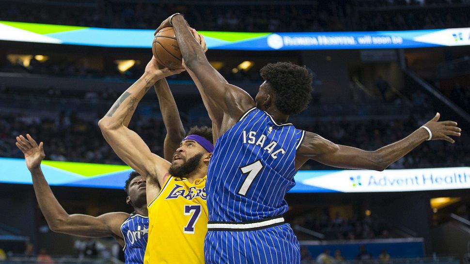 Orlando Magic forward Jonathan Isaac blocks the shot of Los Angeles center Javale McGee in the Magic's 130-117 win over Lebron James and the Lakers. (AP Photo/Willie J. Allen, Jr.)