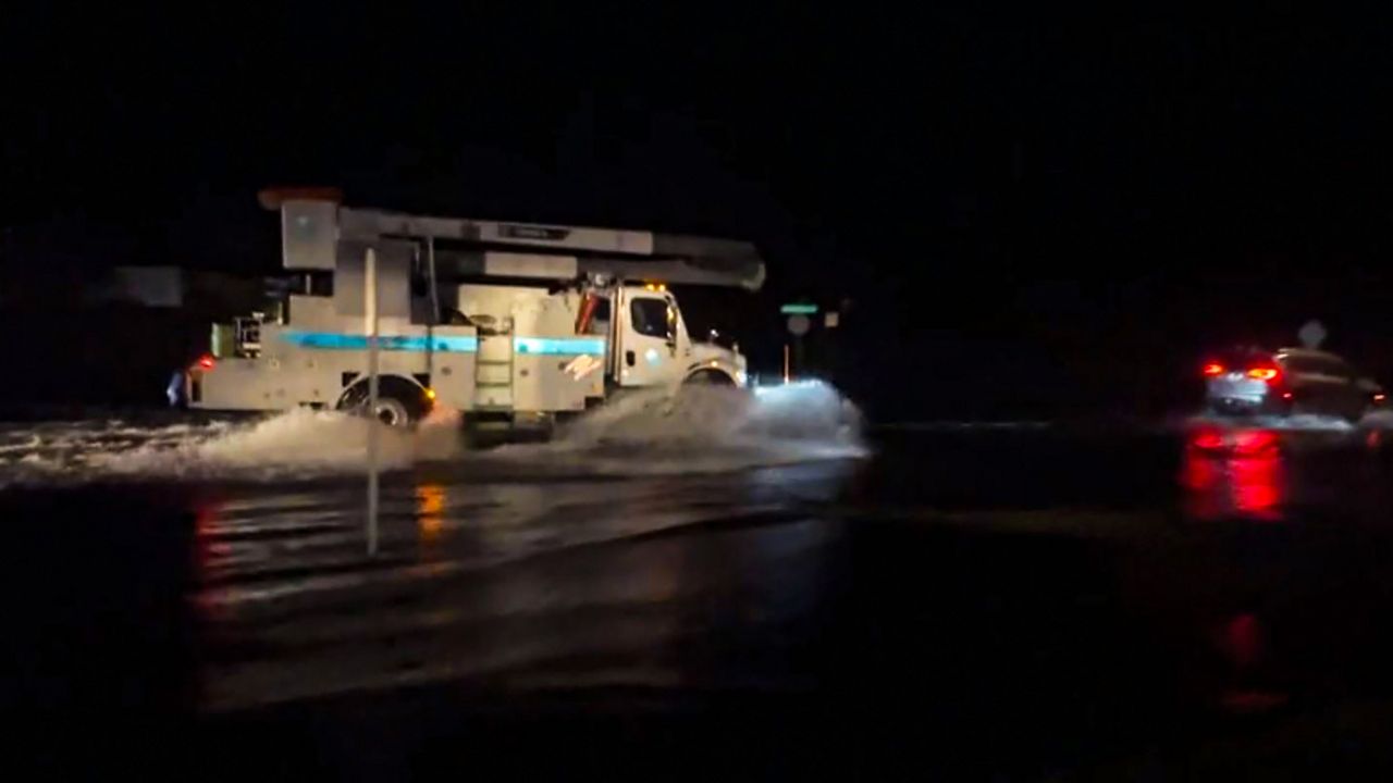 Flooded streets were common in the Palm Bay due to heavy rains. The police department stated flooding left multiple cars submerged past their window levels. (Spectrum News 13)