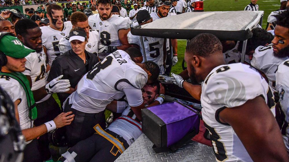 UCF quarterback McKenzie Milton is carted off the field with a severe leg injury. (UCF)