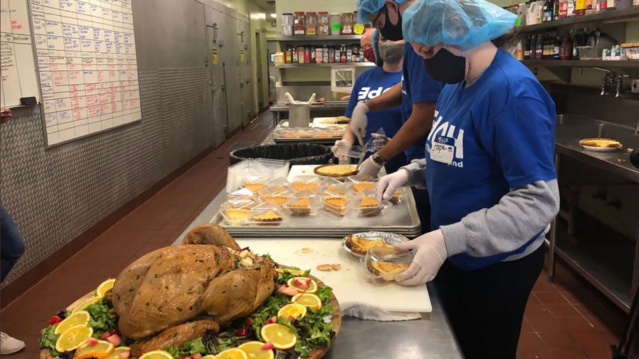 On Thanksgiving morning, a team of staff members and volunteers cooked and boxed thousands of dinners. They were then packaged and sent to two different locations in the Tampa area to be distributed to those in need. (Angie Angers/Spectrum Bay News 9)