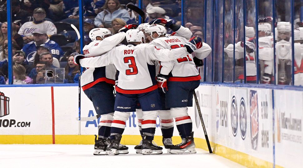 Washington Capitals celebrate a goal from center Aliaksei Protas (21) during the second period of an NHL hockey game against the Tampa Bay Lightning, Wednesday, Nov. 27, 2024, in Tampa, Fla. (AP Photo/Jason Behnken)