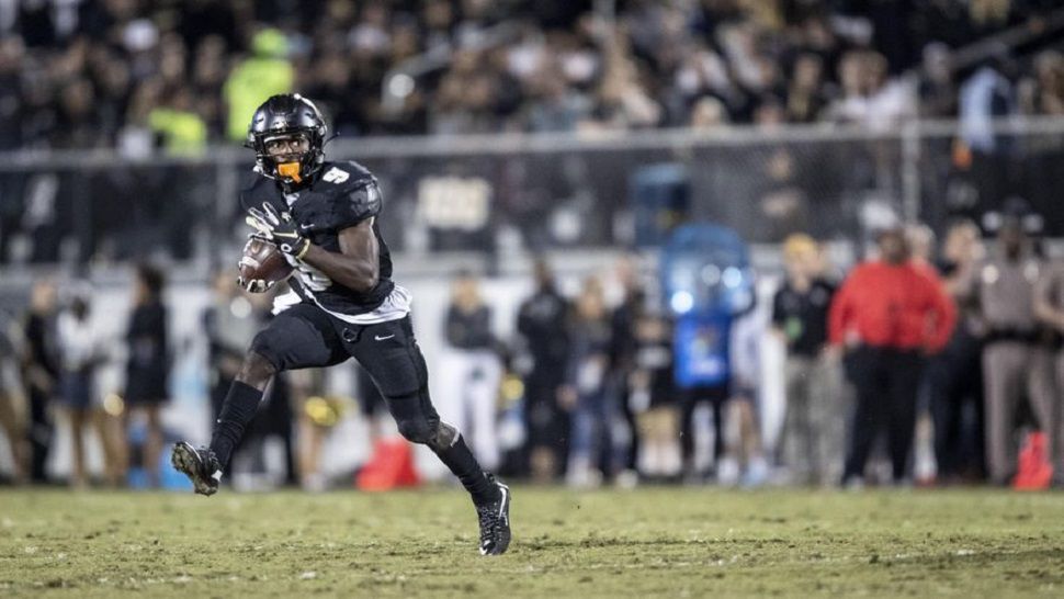 UCF senior running back Adrian Killins breaks into the open field during the first half of the Knights' 34-7 win over rival USF.  The Bulls still lead the all-time series between the rivals 6-5.  (AP Photo/Willie J. Allen, Jr.)