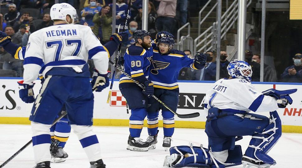 St. Louis Blues' Ryan O'Reilly (90) celebrates with teammate Jordan Kyrou after scoring a goal against the Tampa Bay Lightning during the second period of an NHL hockey game Tuesday, Nov. 30, 2021, in St. Louis. (AP Photo/Scott Kane)