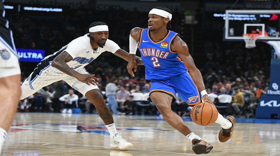 Oklahoma City Thunder guard Shai Gilgeous-Alexander (2) pushes past Orlando Magic guard Kentavious Caldwell-Pope (3) during the second half of an NBA basketball game, Monday, Nov. 4, 2024, in Oklahoma City. (AP Photo/Kyle Phillips)