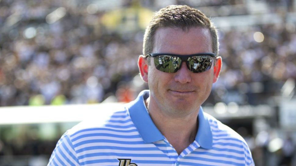 FILE - In this Nov. 2, 2019, file photo, UCF athletic director Danny White stands on the sideline at the team's NCAA college football game against Houston in Orlando, Fla. White has signed a five-year contract that will pay him more than $1 million annually. (AP Photo/Willie J. Allen Jr., File)