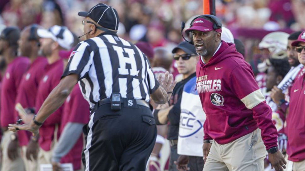 Florida State head coach Willie Taggart, right, disagrees with the referee in the first half of an NCAA college football game against Miami in Tallahassee, Fla., Saturday, Nov. 2, 2019. (AP Photo/Mark Wallheiser)