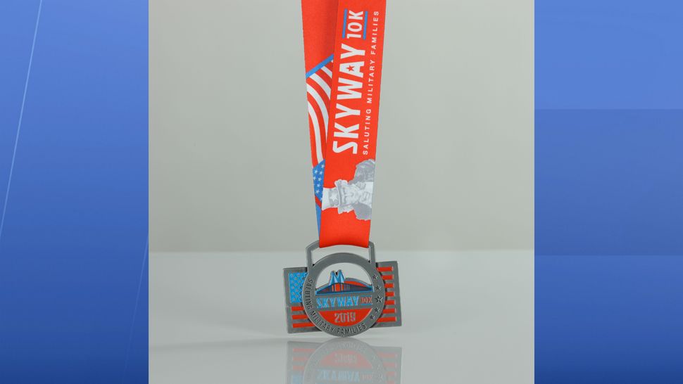 The front of the official race medal features a rendering of the Skyway Bridge on a circle centerpiece with the engraving “Saluting Military Families” along its curvature. (Courtesy of Armed Forces Families Foundation)