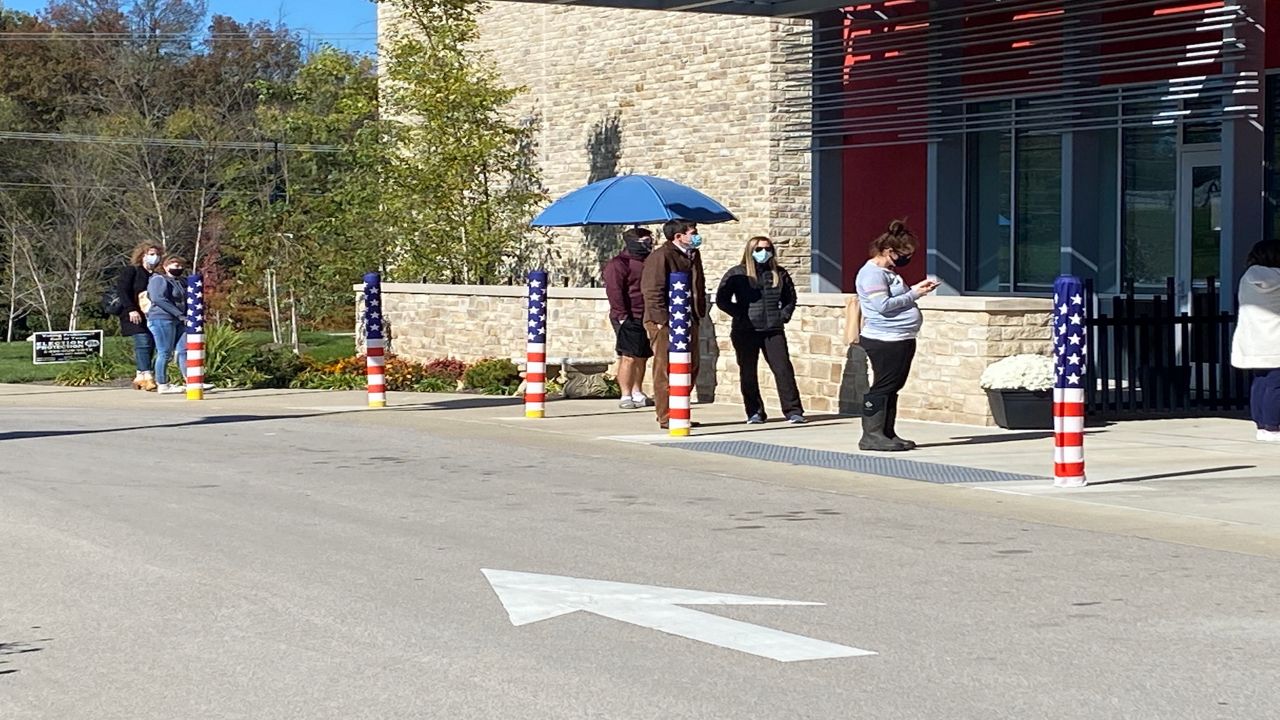 People wait outside the Lexington Senior Center Monday, Nov. 2, to vote early. 