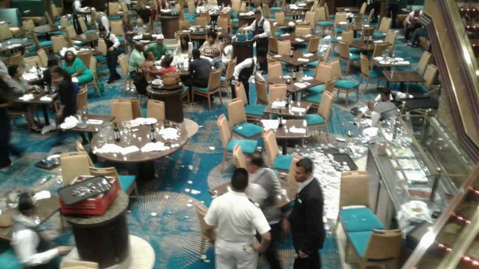 Tableware is strewn across the floor in a dining hall aboard the Carnival Sunshine after it suddenly 'listed' on its most recent trip. (Courtesy of Kristen Smith)
