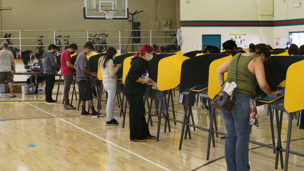 Voters fill out ballots on Election Day inside the Ruben F. Salazar Park recreation center, Tuesday, Nov. 3, 2020, in Los Angeles. (AP Photo/Damian Dovarganes)