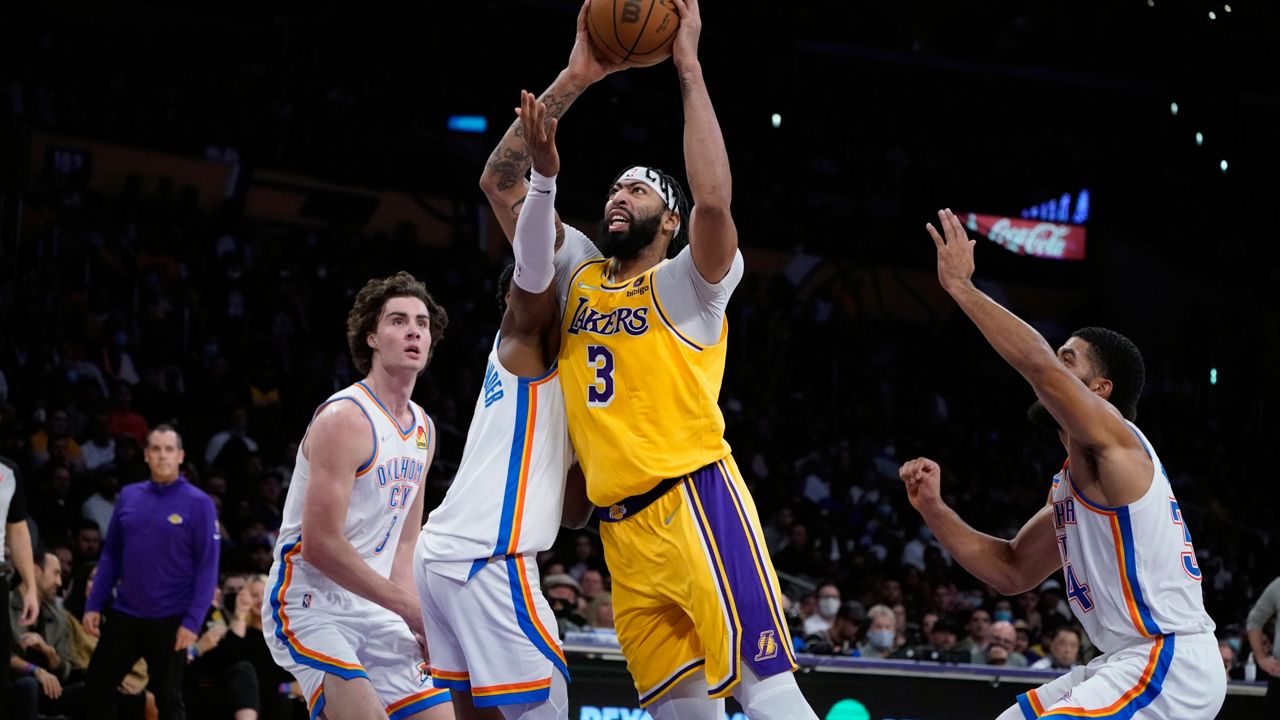 Los Angeles Lakers forward Anthony Davis (3) shoots against the Oklahoma City Thunder during the first half of an NBA basketball game Thursday, Nov. 4, 2021, in Los Angeles. (AP Photo/Marcio Jose Sanchez)
