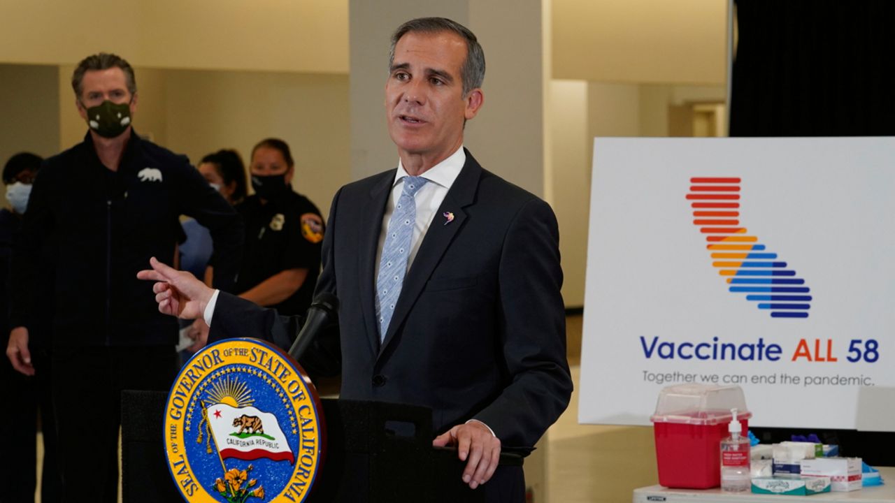 LA Mayor Eric Garcetti addresses questions about the COVID-19 vaccines at the Baldwin Hills Crenshaw Plaza in Los Angeles, April 1, 2021. (AP Photo/Damian Dovarganes