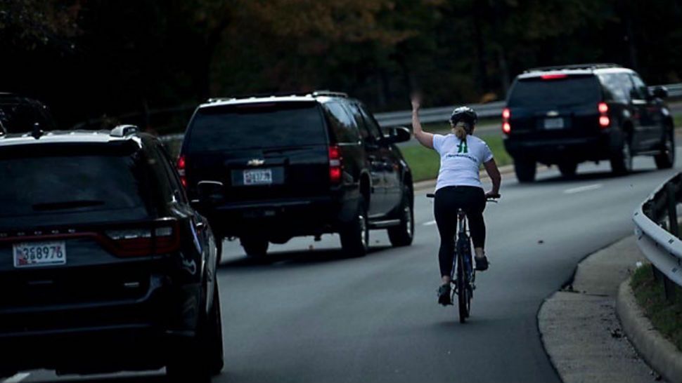 Woman flips off presidential motorcade. Source: Juli Briskman, Facebook