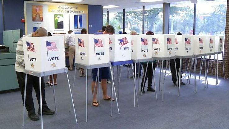 Voters at a polling location. (Spectrum News image)