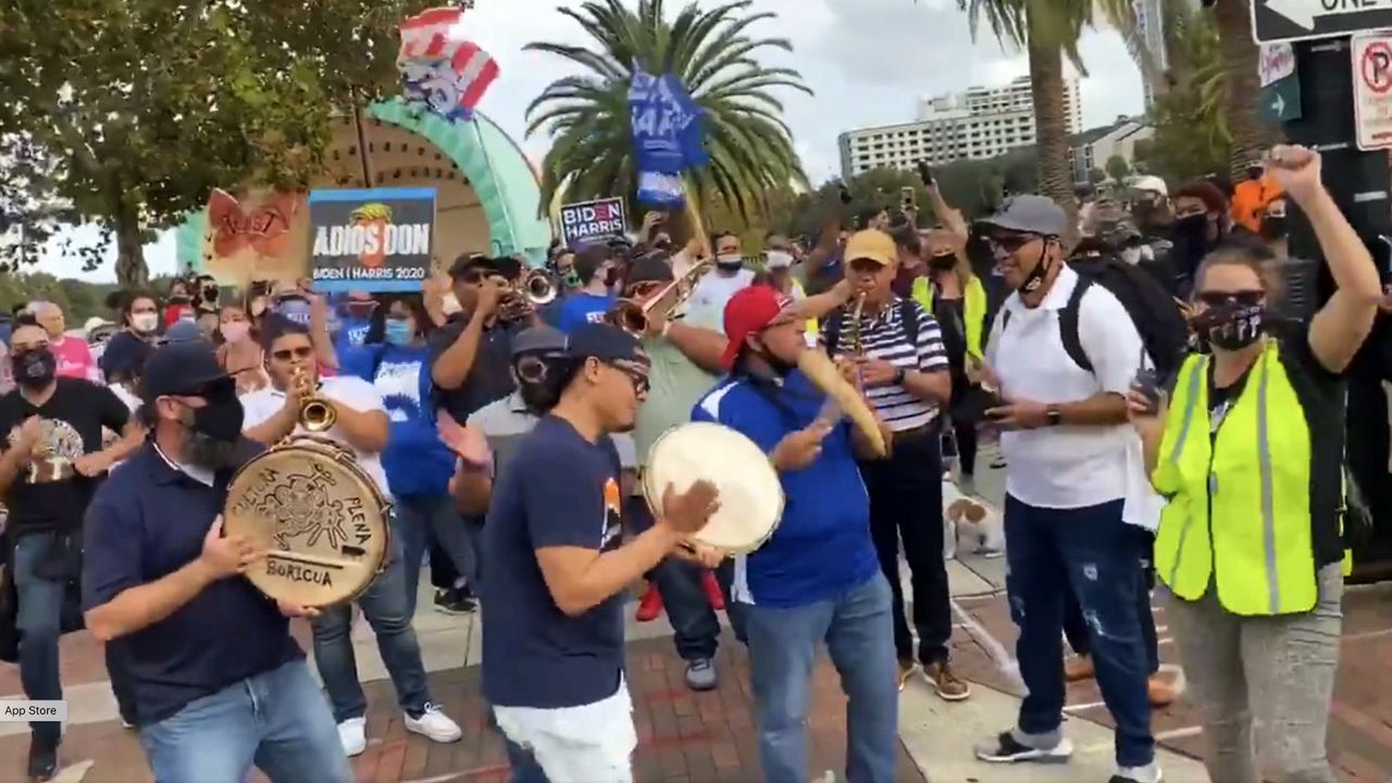 Joe Biden supporters celebrate with music and cheer in downtown Orlando on Saturday, hours after Biden was projected to be president-elect. (Pete Reinwald/Spectrum News 13)