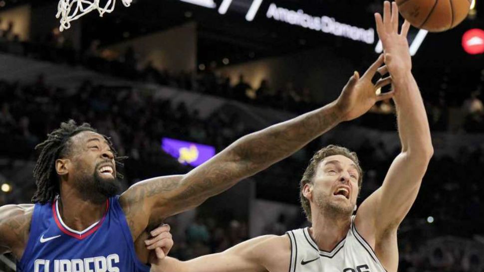 Los Angeles Clippers center DeAndre Jordan (6) chases the rebound against San Antonio Spurs' Pau Gasol, of Spain, during the first half of an NBA basketball game, Tuesday, Nov. 7, 2017, in San Antonio. (Courtesy/David Abate/AP)