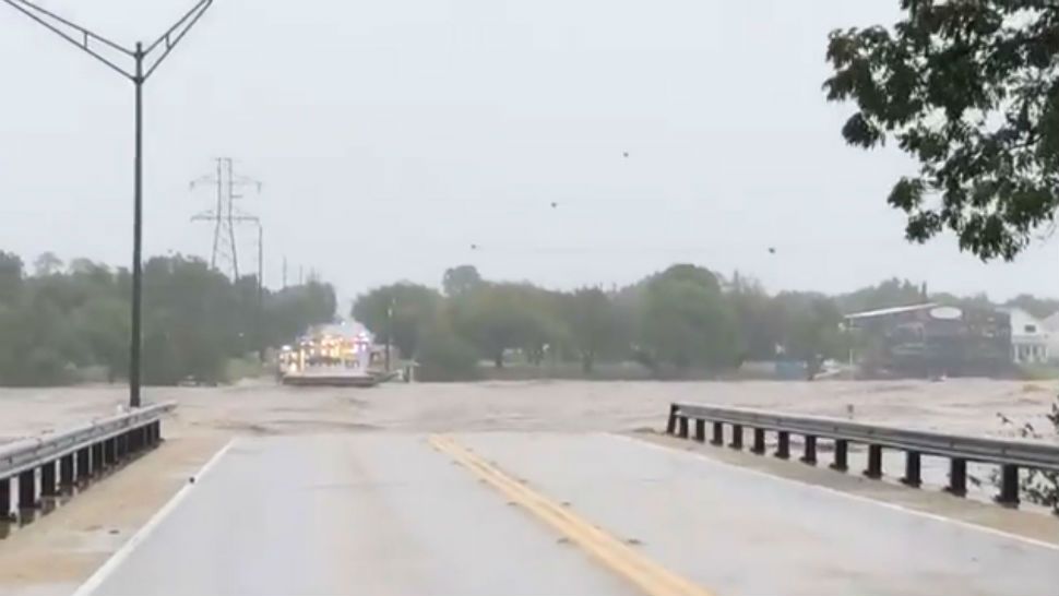 Rising Llano River floodwaters have washed away the RM 2900 bridge in Kingsland. (Spectrum News Photo)