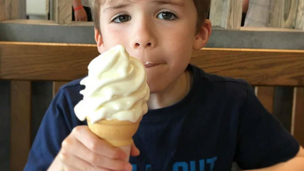 Boy enjoys McDonald's ice cream cone. Courtesy/gordon.milligan, Flickr