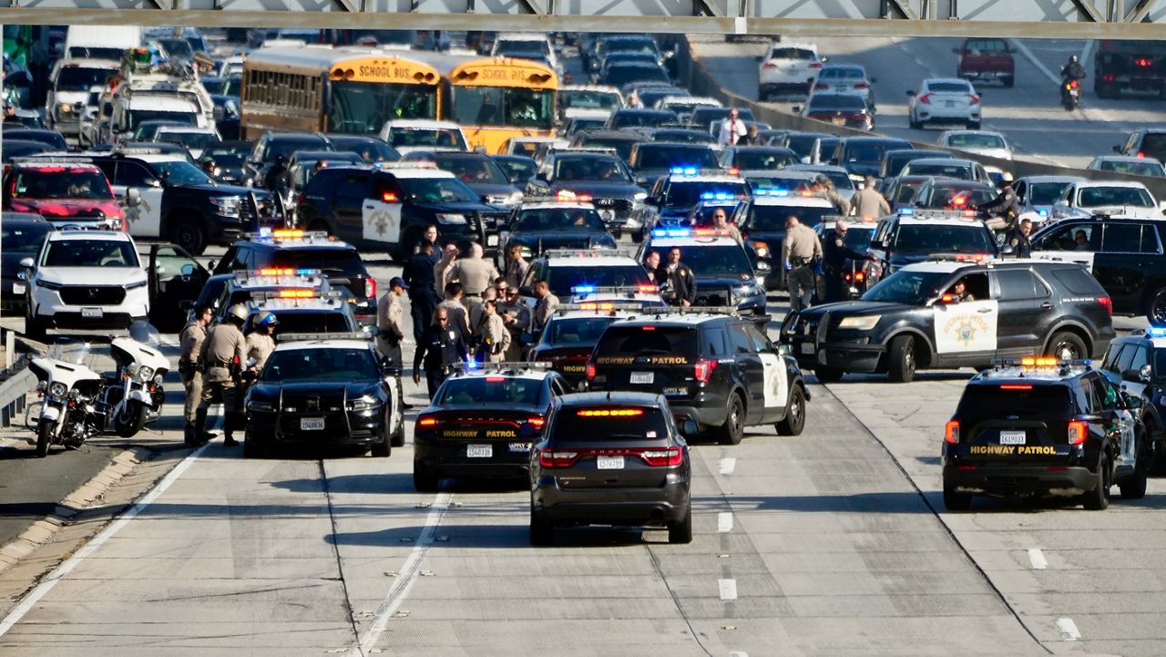In this file photo, police are seen on the 110 Freeway after pro-Palestinian protesters blocked it during the morning commute of Dec. 13, 2023, in Los Angeles. (AP Photo/Marcio Jose Sanchez)